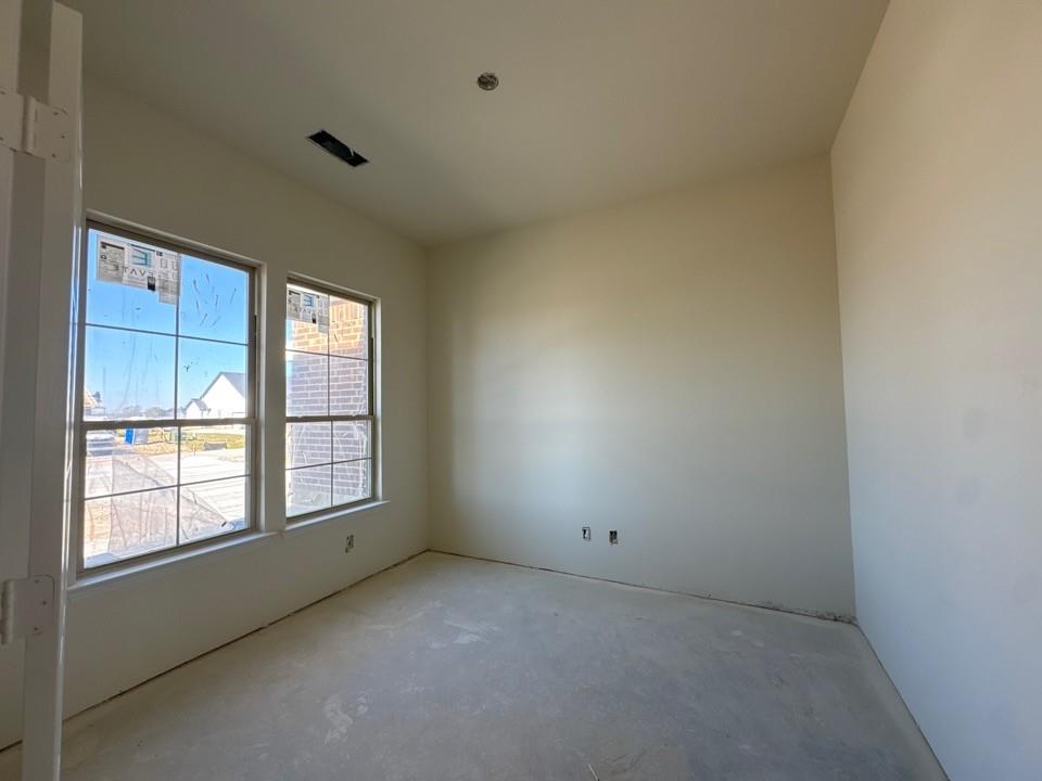 114 Brandywine Trail Rhome, TX 76078 - Photo 3 of 17 an empty room with a window