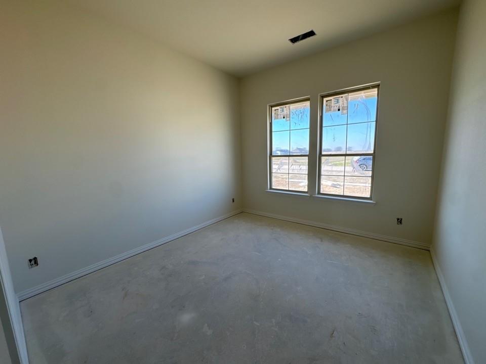 114 Brandywine Trail Rhome, TX 76078 - Photo 5 of 17 an empty room with a window