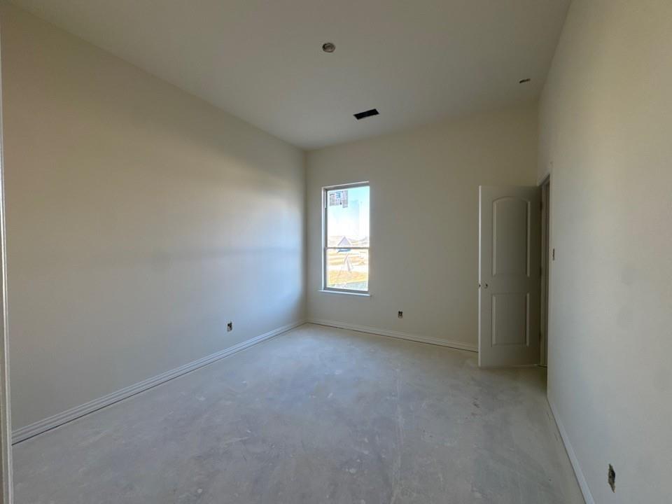 114 Brandywine Trail Rhome, TX 76078 - Photo 10 of 17 a view of an empty room with a window