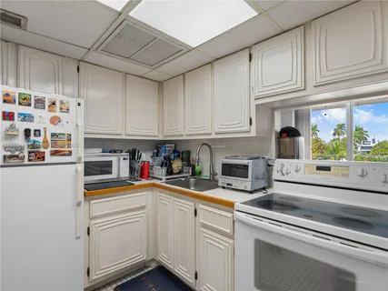 a kitchen with stainless steel appliances granite countertop a sink and cabinets