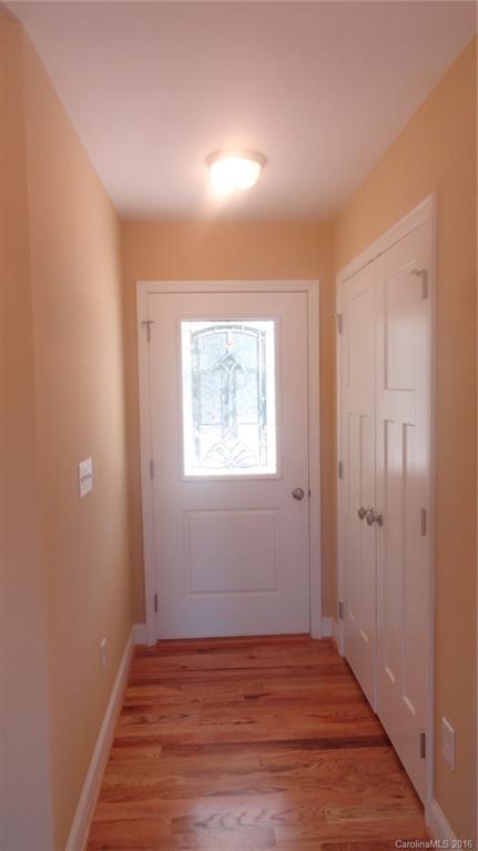4767 Kemp Dellinger Road, Unit 2 Maiden, NC 28650 - Photo 2 of 21 a view of an empty room with wooden floor and a window