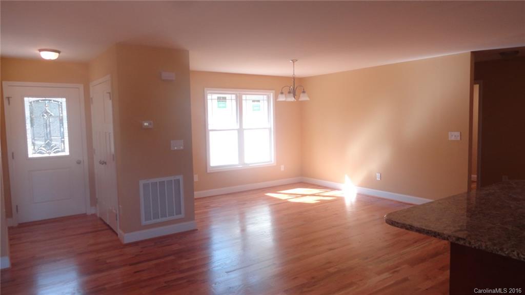 4767 Kemp Dellinger Road, Unit 2 Maiden, NC 28650 - Photo 16 of 21 an empty room with wooden floor and windows