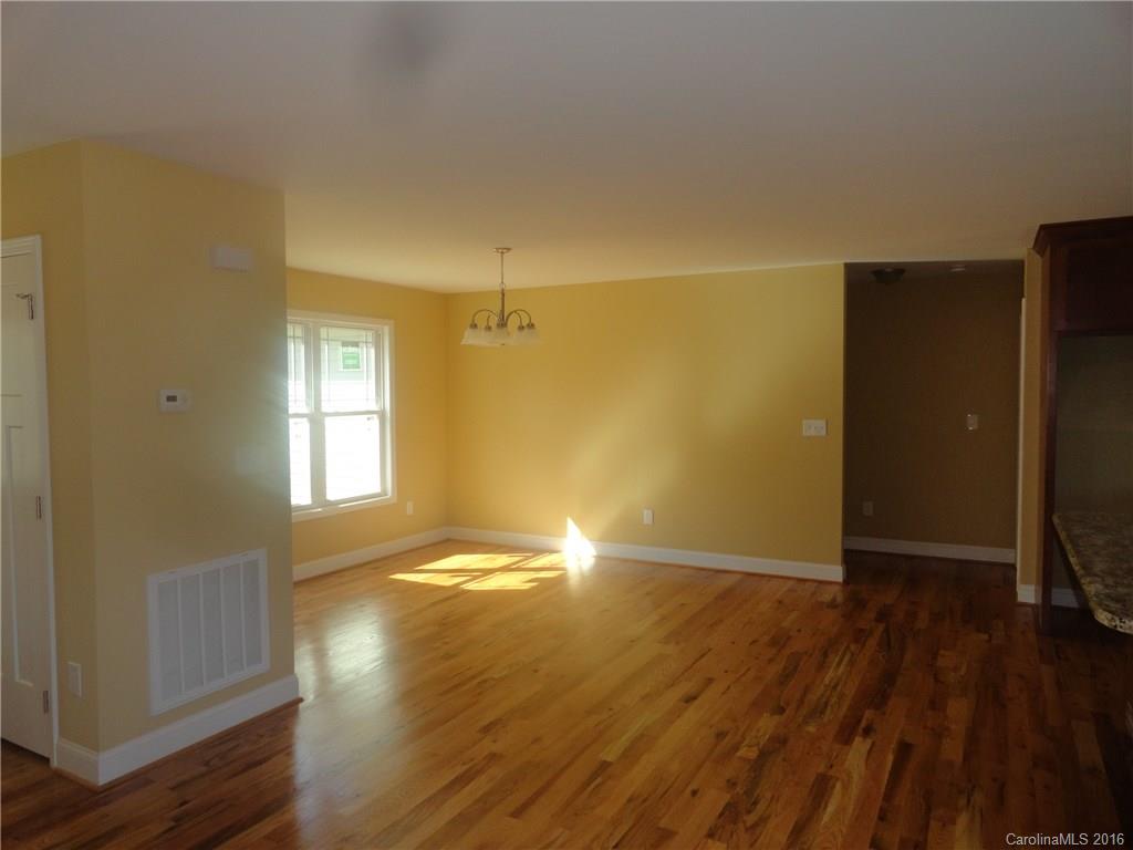 4767 Kemp Dellinger Road, Unit 2 Maiden, NC 28650 - Photo 17 of 21 an empty room with wooden floor and windows