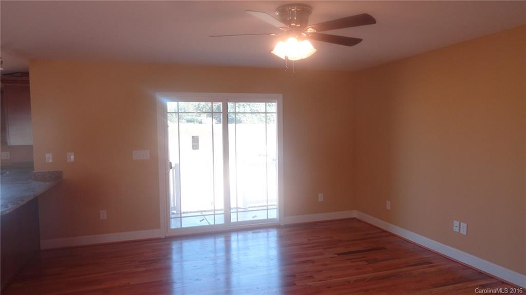 4767 Kemp Dellinger Road, Unit 2 Maiden, NC 28650 - Photo 3 of 21 a view of empty room with wooden floor and fan