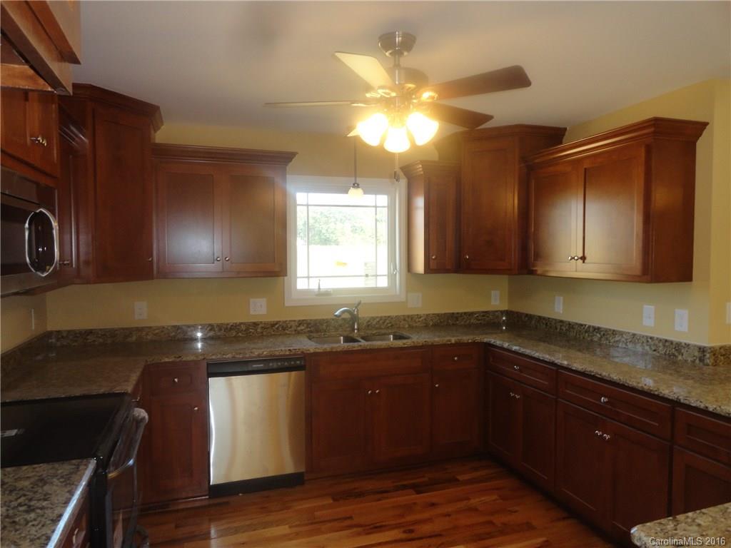 4767 Kemp Dellinger Road, Unit 2 Maiden, NC 28650 - Photo 8 of 21 a kitchen with a sink and a stove