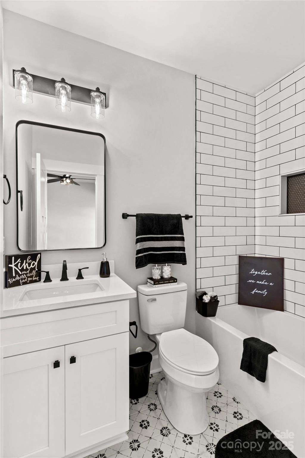 1215 Coppergate Drive Salisbury, NC 28147 - Photo 16 of 41 a bathroom with a toilet a sink a mirror and a bathtub