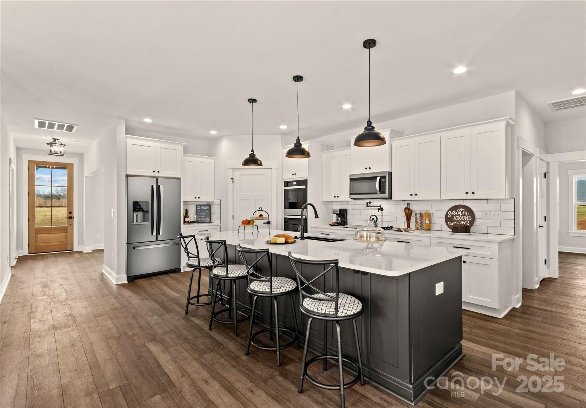 1215 Coppergate Drive Salisbury, NC 28147 - Photo 38 of 41 a kitchen with stainless steel appliances kitchen island granite countertop a sink and refrigerator