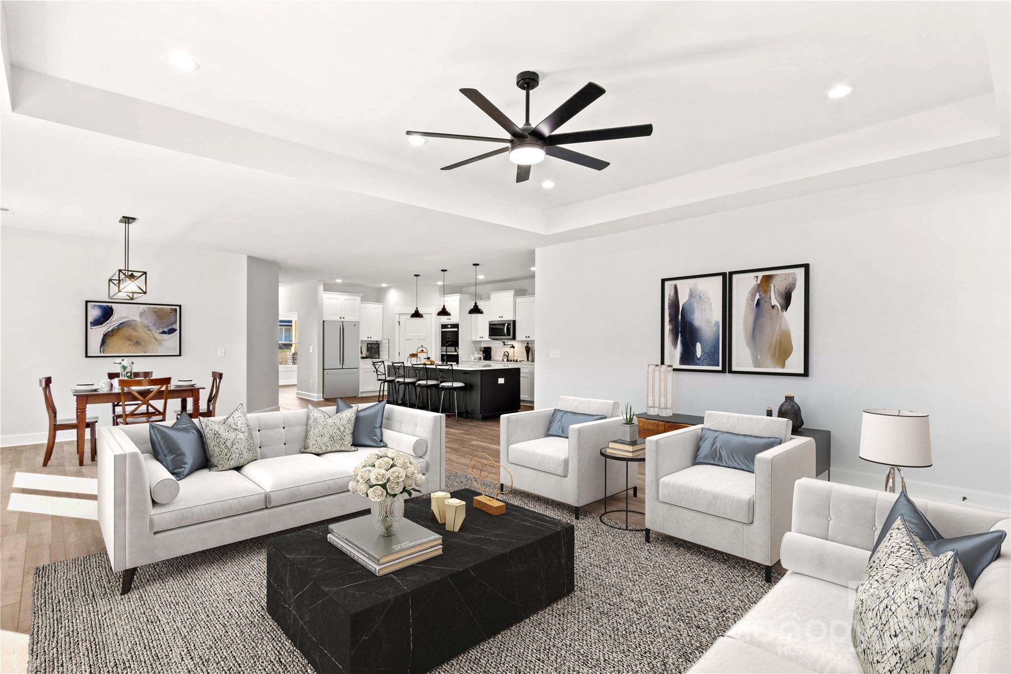 1215 Coppergate Drive Salisbury, NC 28147 - Photo 7 of 41 a living room with furniture and a chandelier