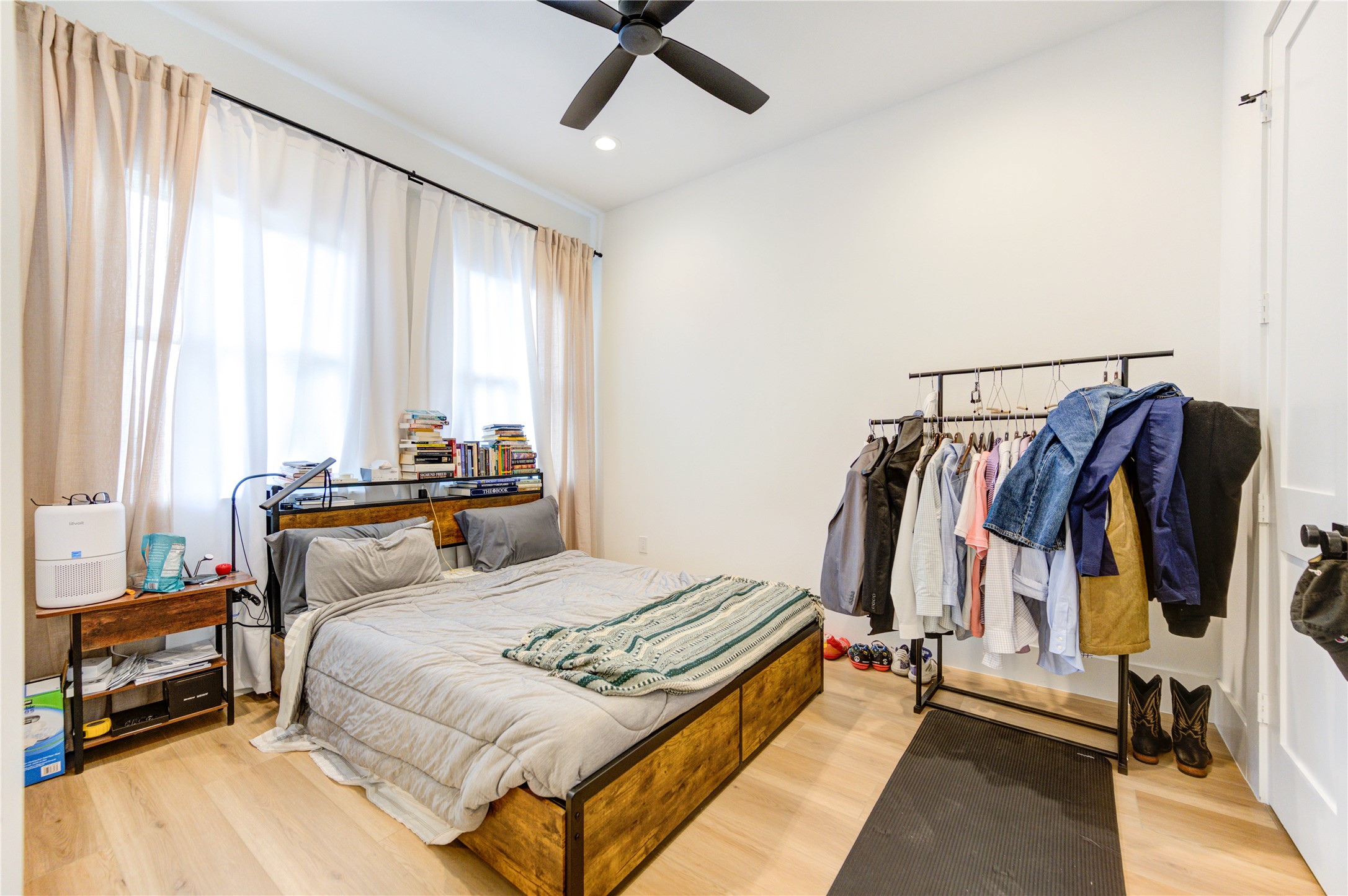 18 Sidney Street, Unit A Houston, TX 77003 - Photo 24 of 30 a bedroom with a bed and walk in closet