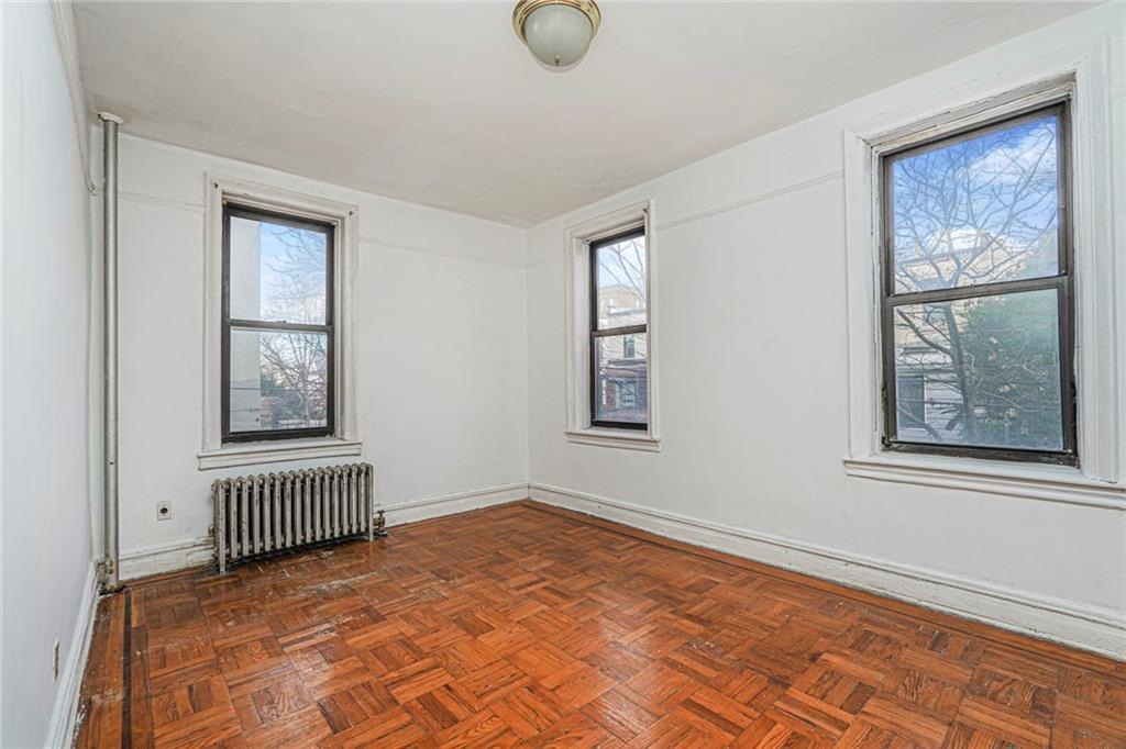 255 79th Street, Unit B2 Brooklyn, NY 11209 - Photo 14 of 22 a view of an empty room with windows