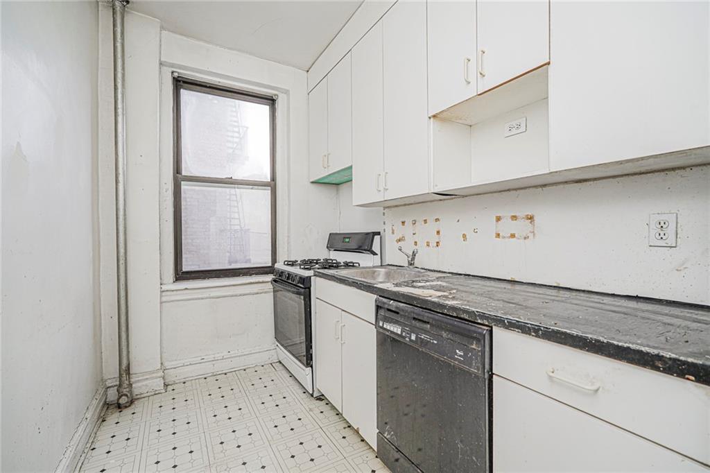 255 79th Street, Unit B2 Brooklyn, NY 11209 - Photo 16 of 22 a kitchen with stainless steel appliances granite countertop a sink and a stove