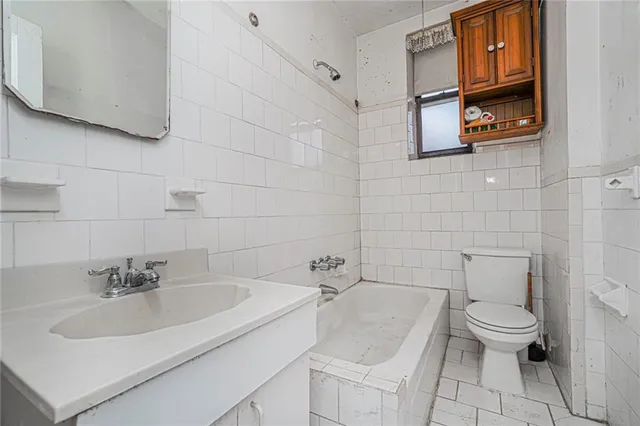 a bathroom with a sink toilet and vanity