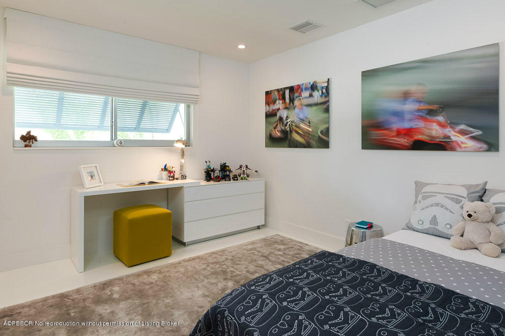 1225 Lands End Road Manalapan, FL 33462 - Photo 15 of 28 a bedroom with a bed and a window