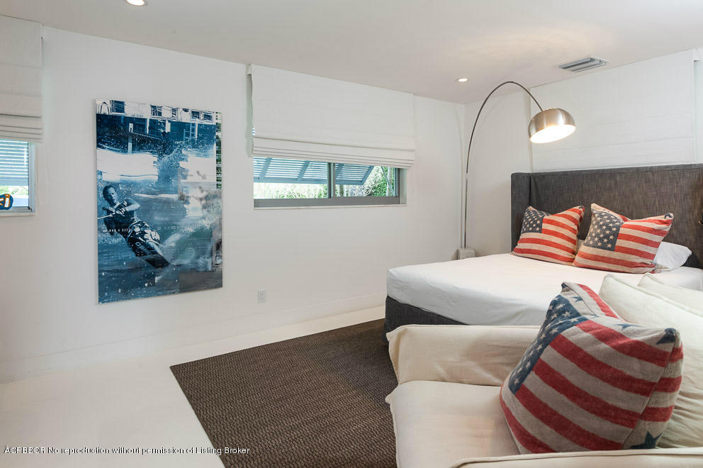 1225 Lands End Road Manalapan, FL 33462 - Photo 17 of 28 a bedroom with furniture and a painting on the wall