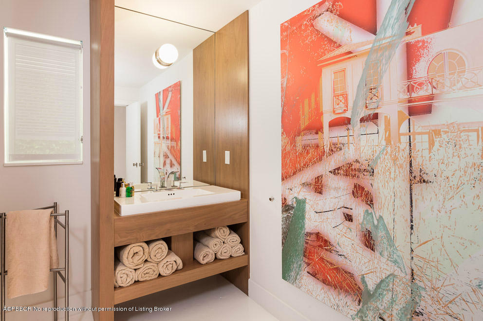 1225 Lands End Road Manalapan, FL 33462 - Photo 18 of 28 a bathroom with a sink and a mirror