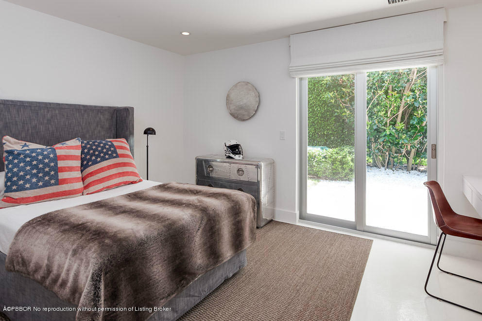 1225 Lands End Road Manalapan, FL 33462 - Photo 20 of 28 a bedroom with double bed and a window