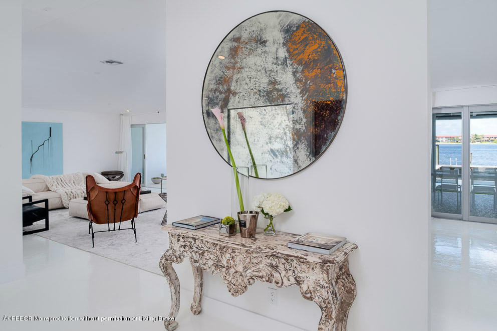 1225 Lands End Road Manalapan, FL 33462 - Photo 4 of 28 a living room with furniture a mirror and a table