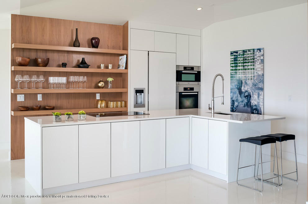 1225 Lands End Road Manalapan, FL 33462 - Photo 7 of 28 a kitchen with stainless steel appliances a refrigerator and cabinets