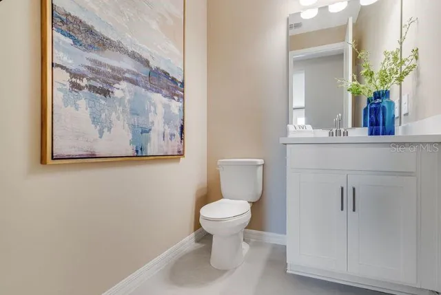 a living room with furniture a flat screen tv and a floor to ceiling window
