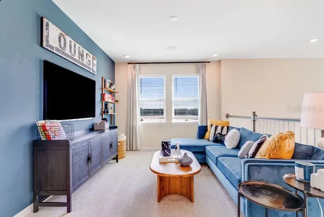 a living room with furniture and a couch