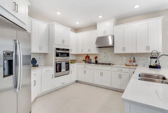 a bedroom with a bed table and a window