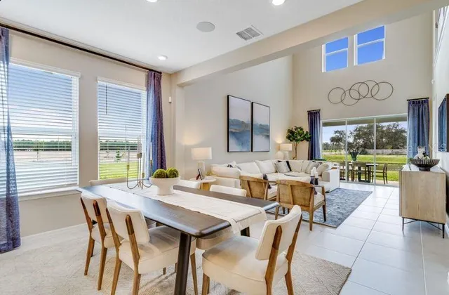 a kitchen with white cabinets and refrigerator