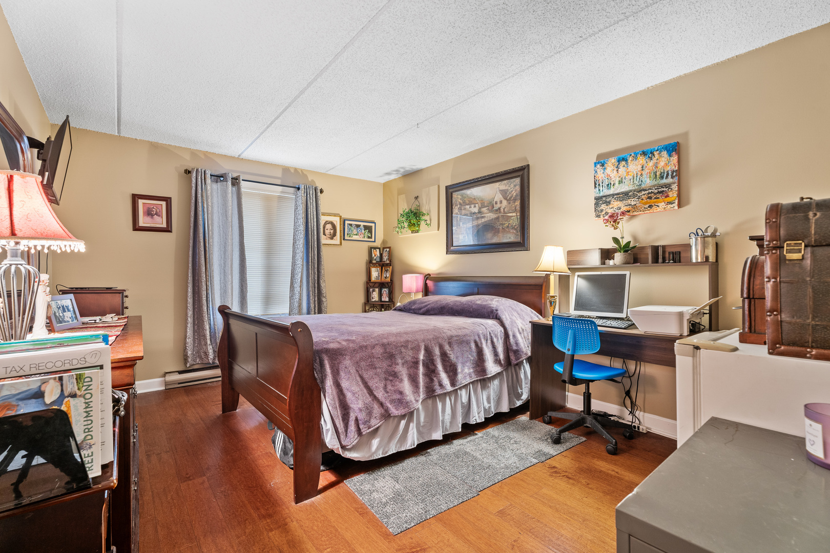 730 Briar Hill Lane, Unit 1 Addison, IL 60101 - Photo 11 of 16 a bedroom with a bed and wooden floor