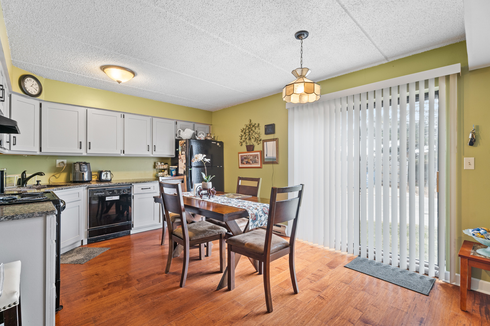 730 Briar Hill Lane, Unit 1 Addison, IL 60101 - Photo 7 of 16 a view of a dining room with furniture window and wooden floor