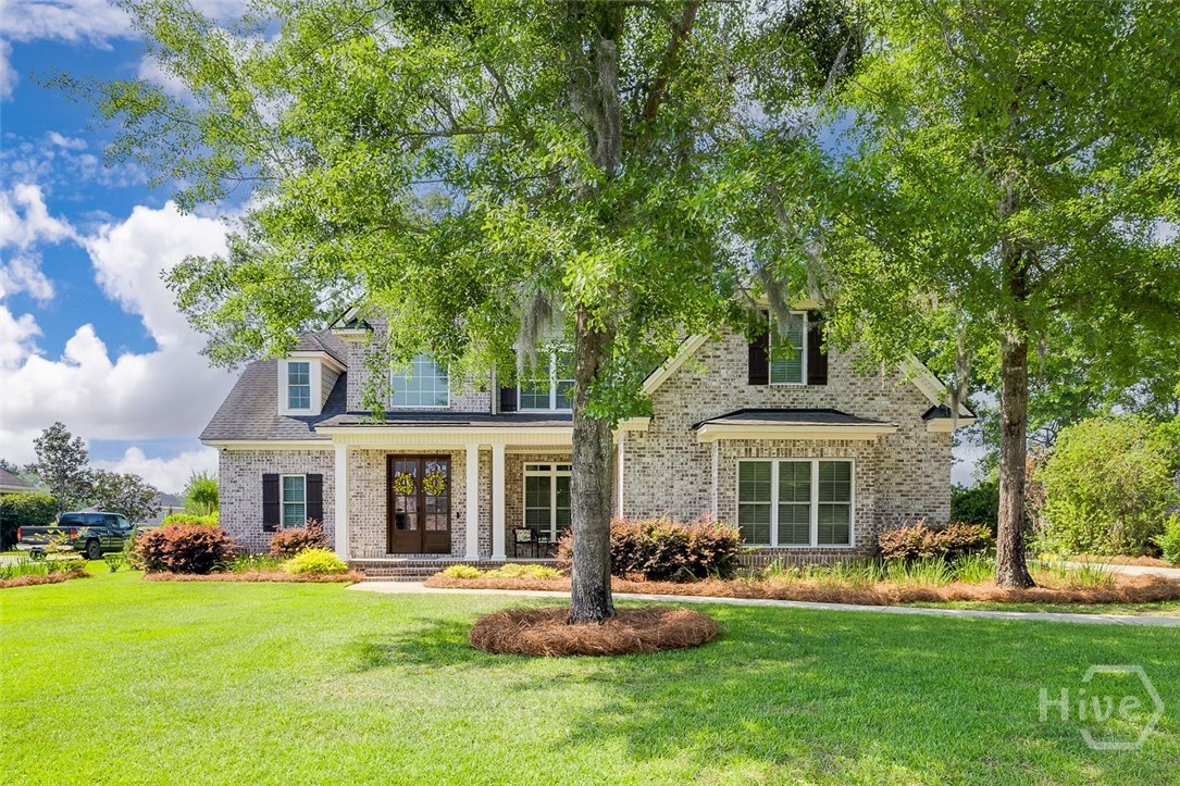 7 Reed Grass Lane Savannah, GA 31405 - Photo 2 of 70 Landscape lighting in the front yard to enhance the beauty of the home at night