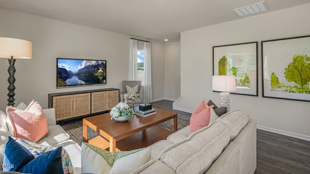 a bedroom with furniture and wooden floor