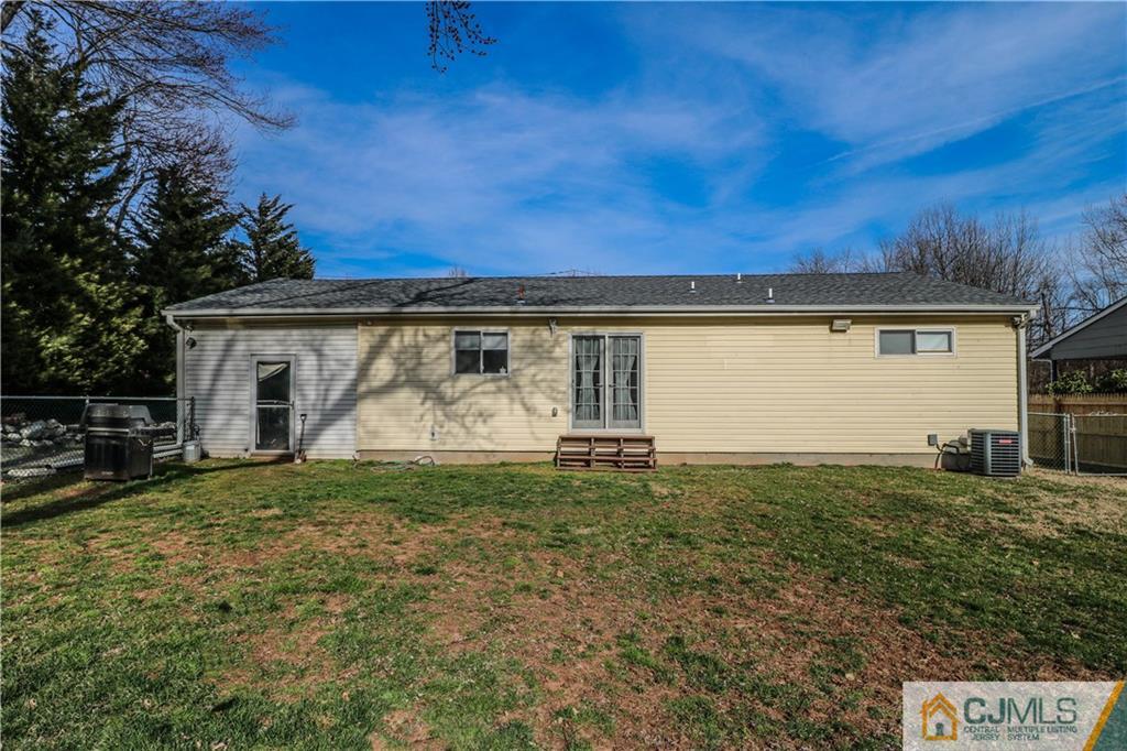 42 Mill Road Edison, NJ 08817 - Photo 22 of 25 a view of a house with backyard