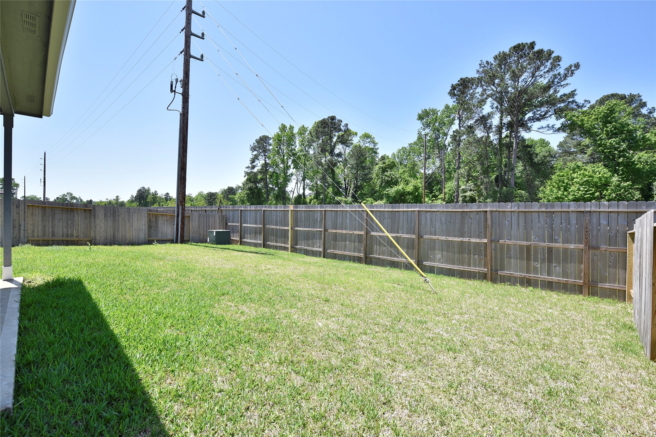 25473 Cilantro Drive Magnolia, TX 77355 - Photo 19 of 21 Enjoy the inviting backyard, complete with a covered deck perfect for relaxing outdoors. With plenty of space, it’s ideal for playtime, entertaining, or simply unwinding.