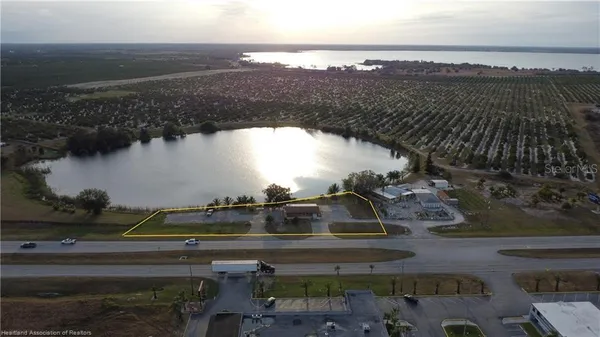 an aerial view of a city and lake view