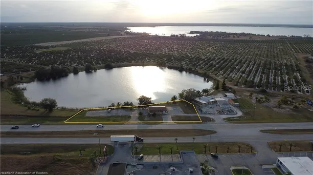 an aerial view of a city and lake view