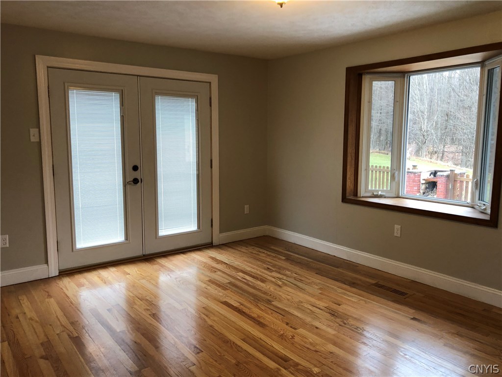 9274 Capron Road Lee, NY 13363 - Photo 22 of 36 Dining room with oak hardwood flooring.