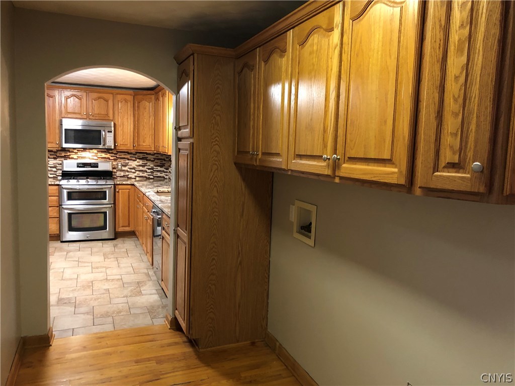 9274 Capron Road Lee, NY 13363 - Photo 31 of 36 Laundry room with oak cabinets for extra storage.