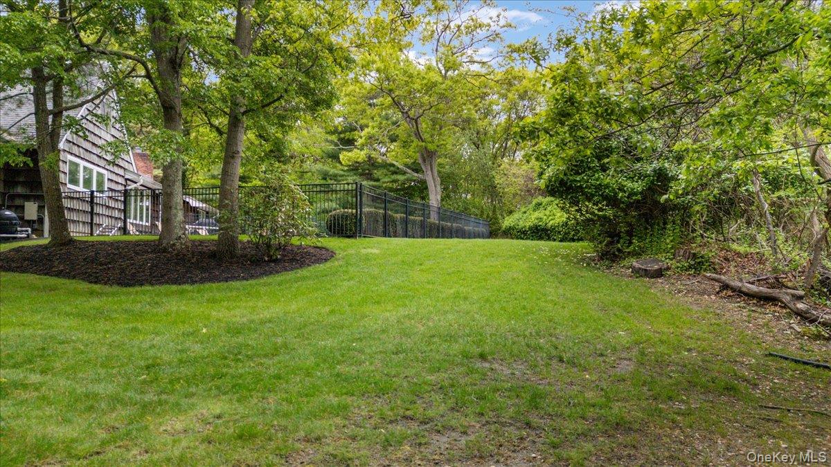 6 Apex Road Melville, NY 11747 - Photo 40 of 50 a view of outdoor space with deck and tree