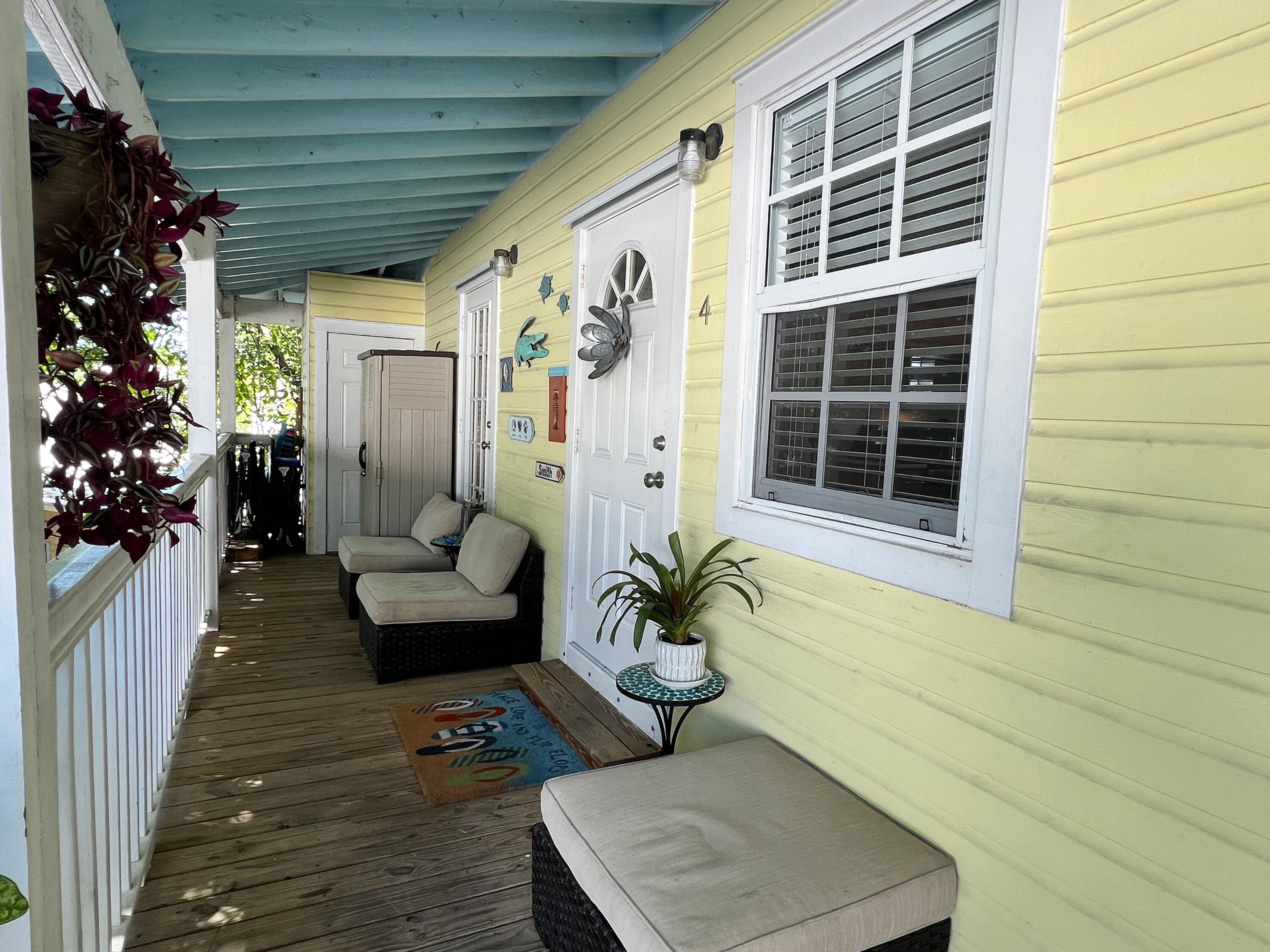 904 Terry Lane, Unit 4 Key West, FL 33040 - Photo 9 of 14 a house view with a seating space