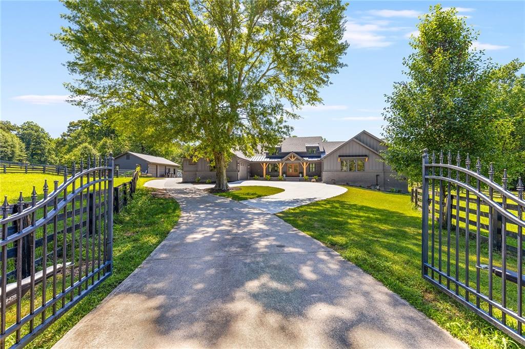 560 Old Lathemtown Road Canton, GA 30115 - Photo 1 of 1 a house view with a garden space