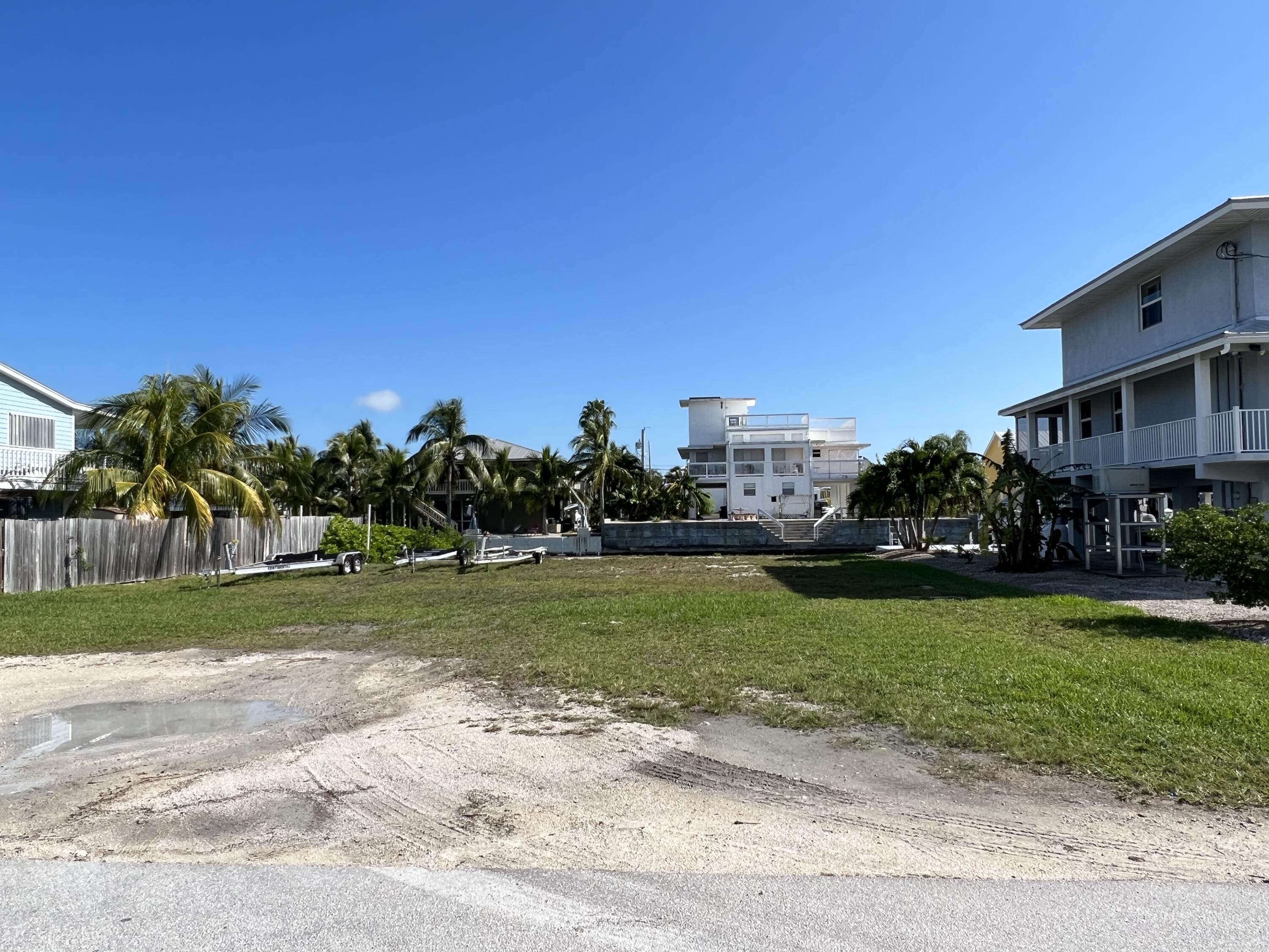 Tamarind Drive Key West, FL 33040 - Photo 1 of 5 a view of a stadium that has a big yard with plants and large trees