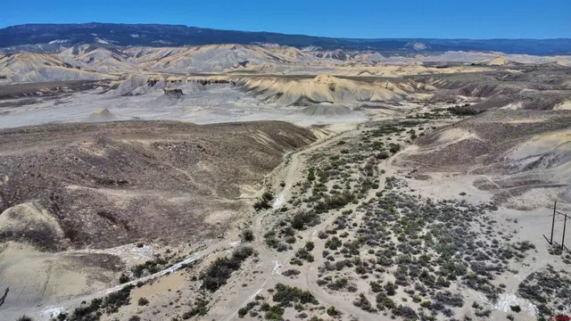 a view of a beach with a city