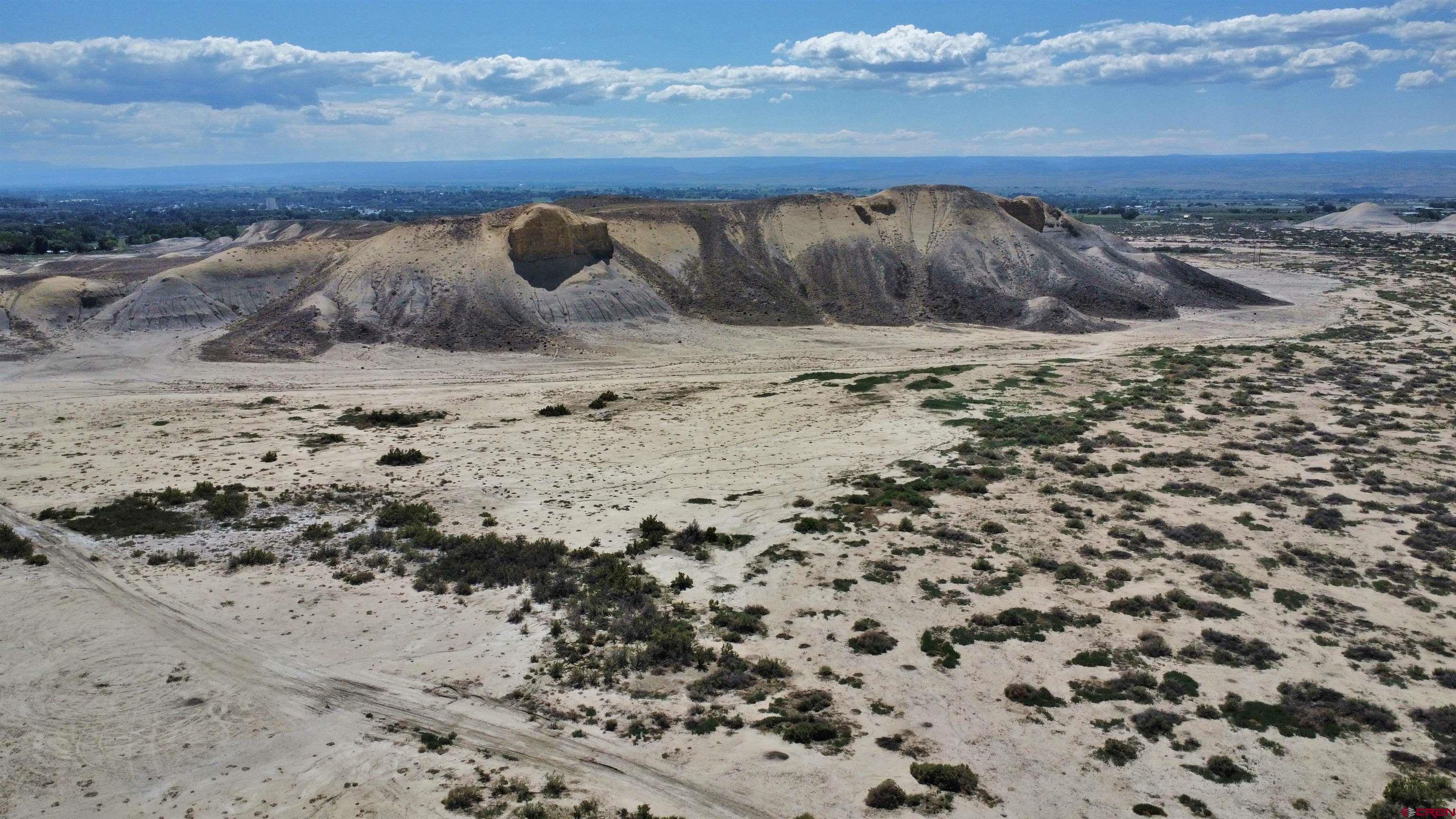 Tbd Devils Thumb Road Delta, CO 81416 - Photo 23 of 30 a view of a dry yard with wooden fence