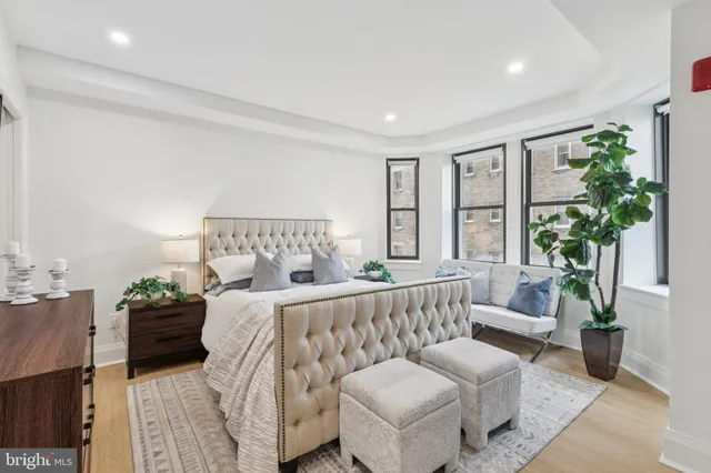 a bedroom with a bed and a couch