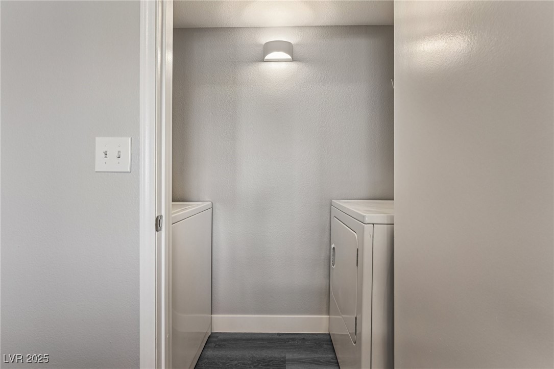 7255 West Sunset Road, Unit 1087 Las Vegas, NV 89113 - Photo 27 of 43 Laundry room featuring washing machine and clothes dryer and dark wood-style floors