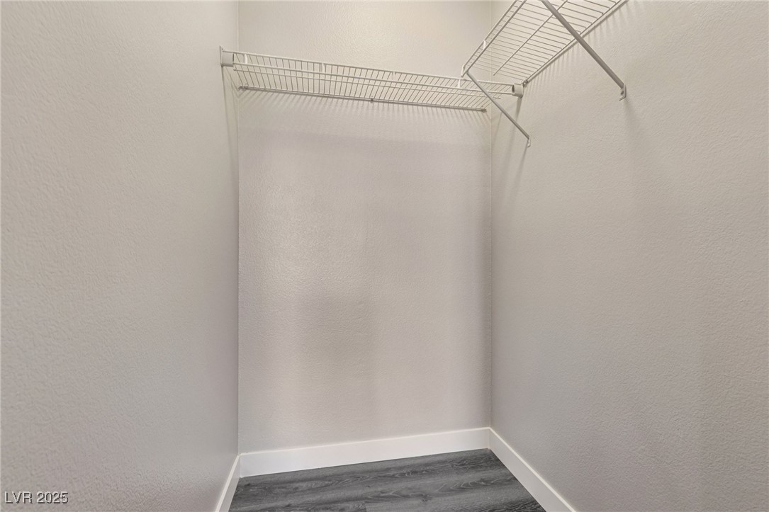 7255 West Sunset Road, Unit 1087 Las Vegas, NV 89113 - Photo 33 of 43 Walk in closet featuring wood finished floors
