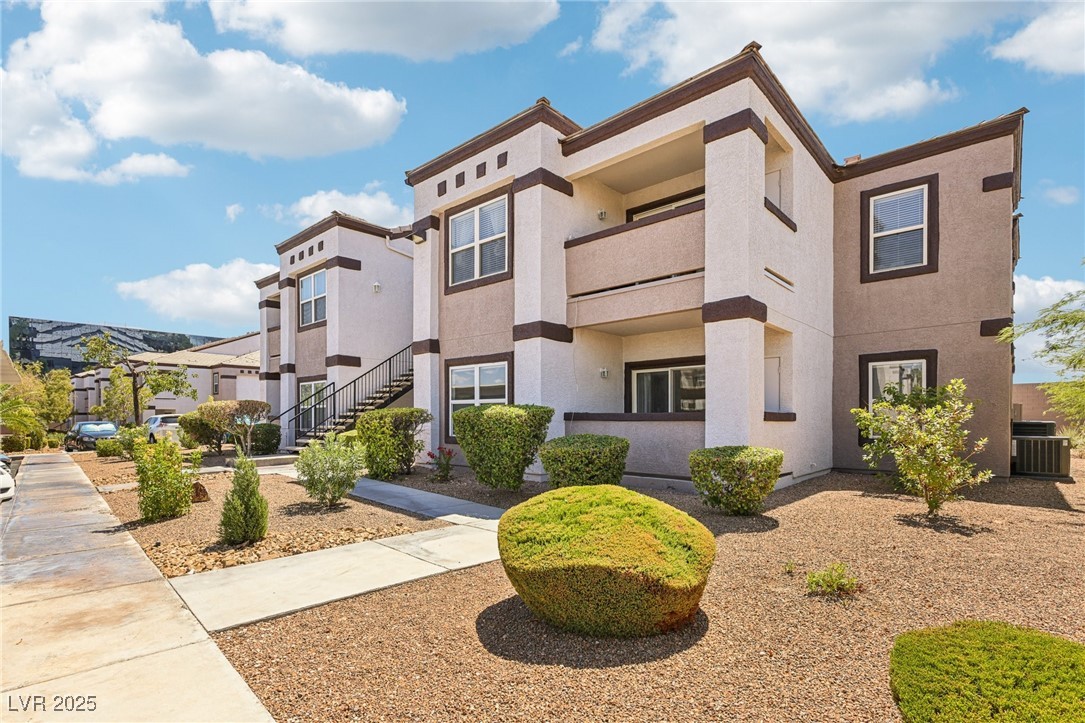 7255 West Sunset Road, Unit 1087 Las Vegas, NV 89113 - Photo 4 of 43 View of building exterior featuring stairs