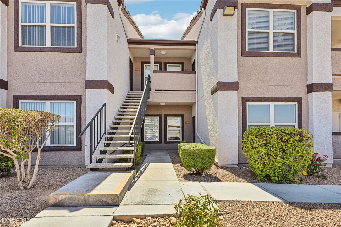 7255 West Sunset Road, Unit 1087 Las Vegas, NV 89113 - Photo 5 of 43 View of building exterior featuring stairway