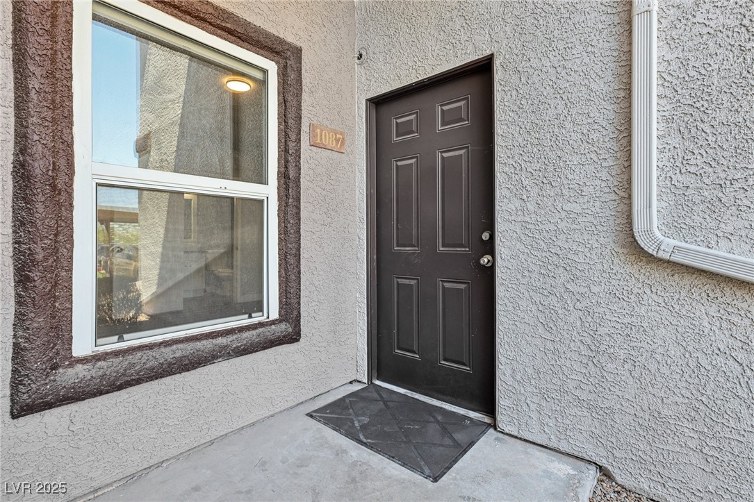 7255 West Sunset Road, Unit 1087 Las Vegas, NV 89113 - Photo 7 of 43 Entrance to property with stucco siding