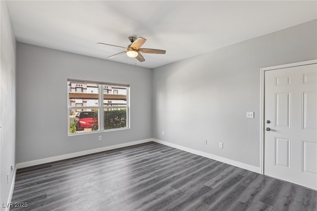 7255 West Sunset Road, Unit 1087 Las Vegas, NV 89113 - Photo 9 of 43 Spare room with dark wood-type flooring and ceiling fan