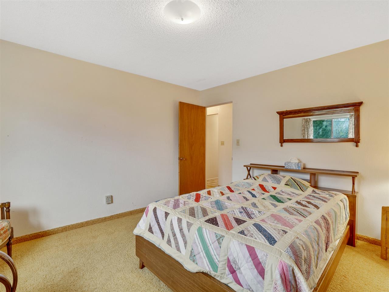 234-28 28 1/2 Road Grand Junction, CO 81503 - Photo 13 of 18 a bedroom with a bed and a painting on the wall
